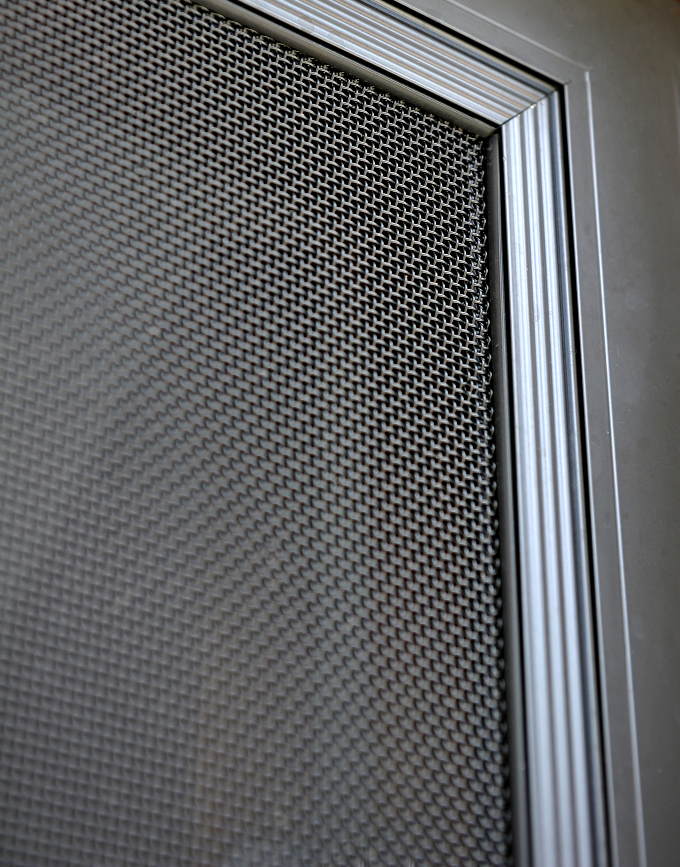 ScreenGuard security window screens on a home exterior