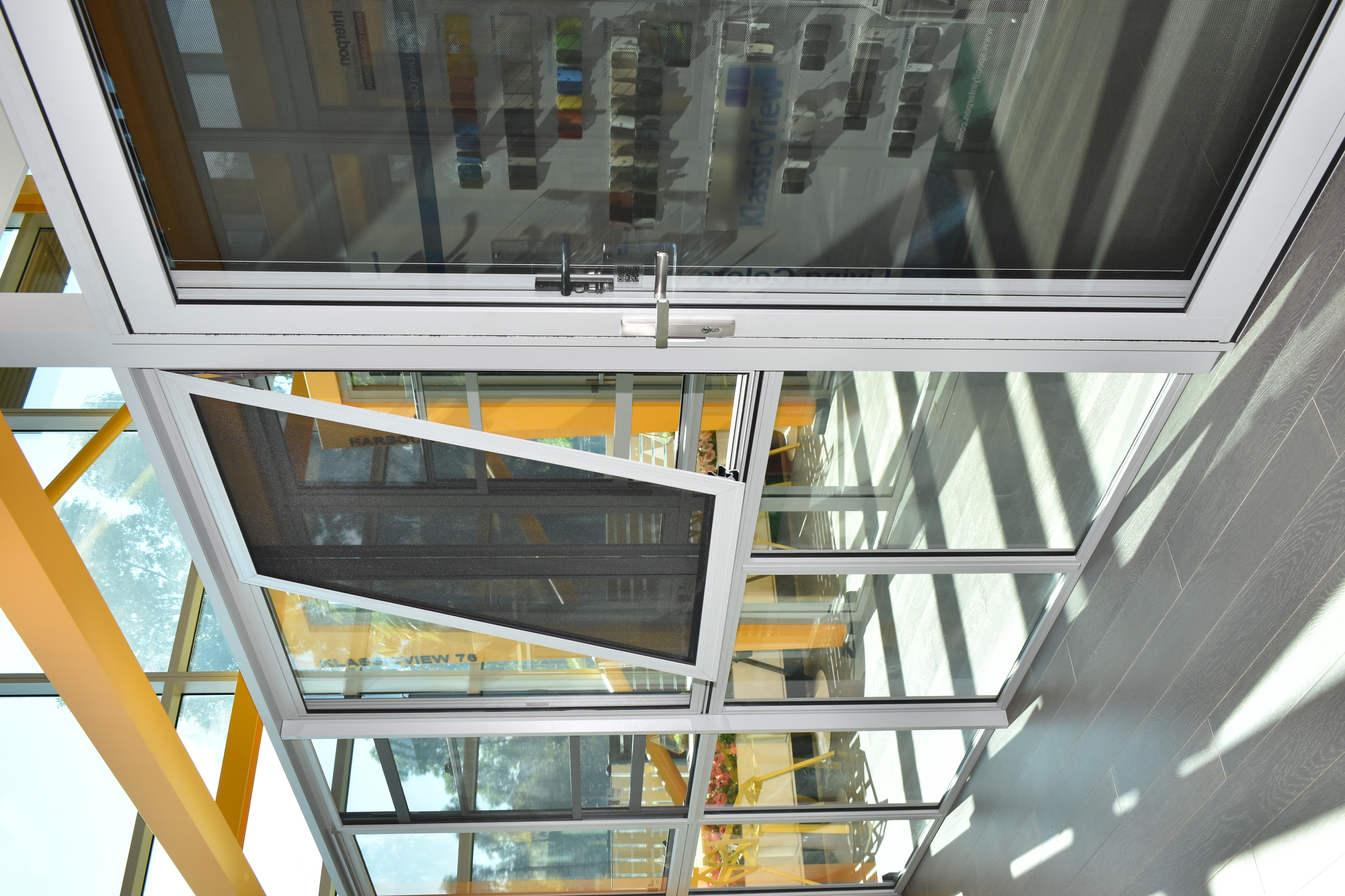 ACCESS fire escape window system — half-open position showing quick release mechanism