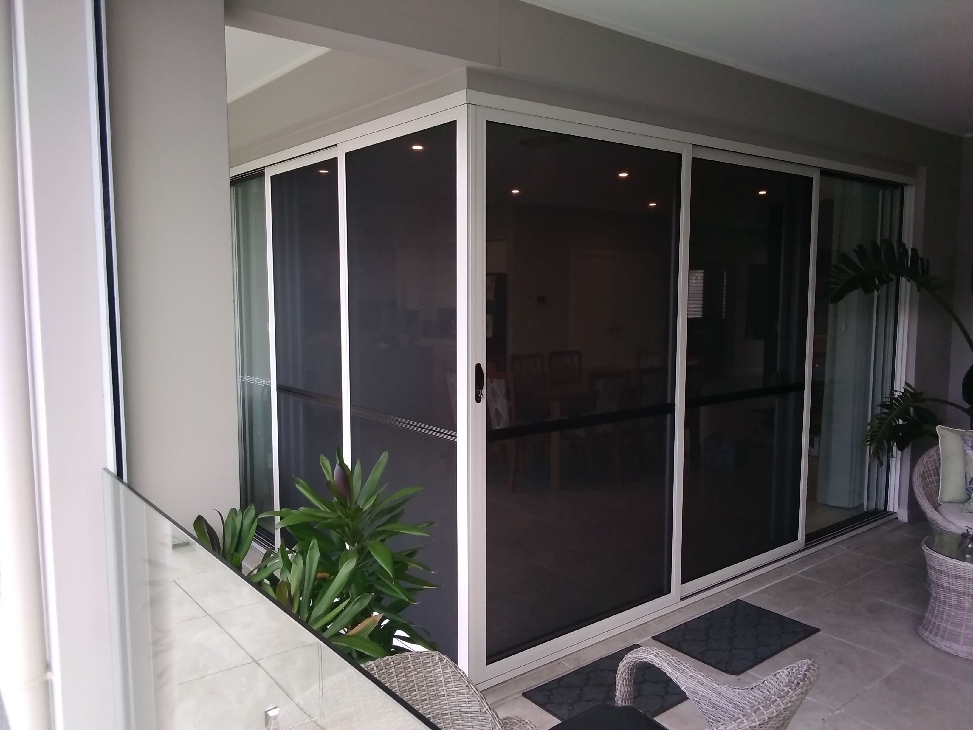 ScreenGuard frameless 90 degree quad set with midrails — exterior view